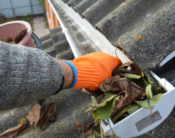 Clean gutters to maintain roof health in Chanhassen