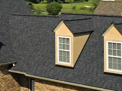 Close up of a large residential roof with black shingles